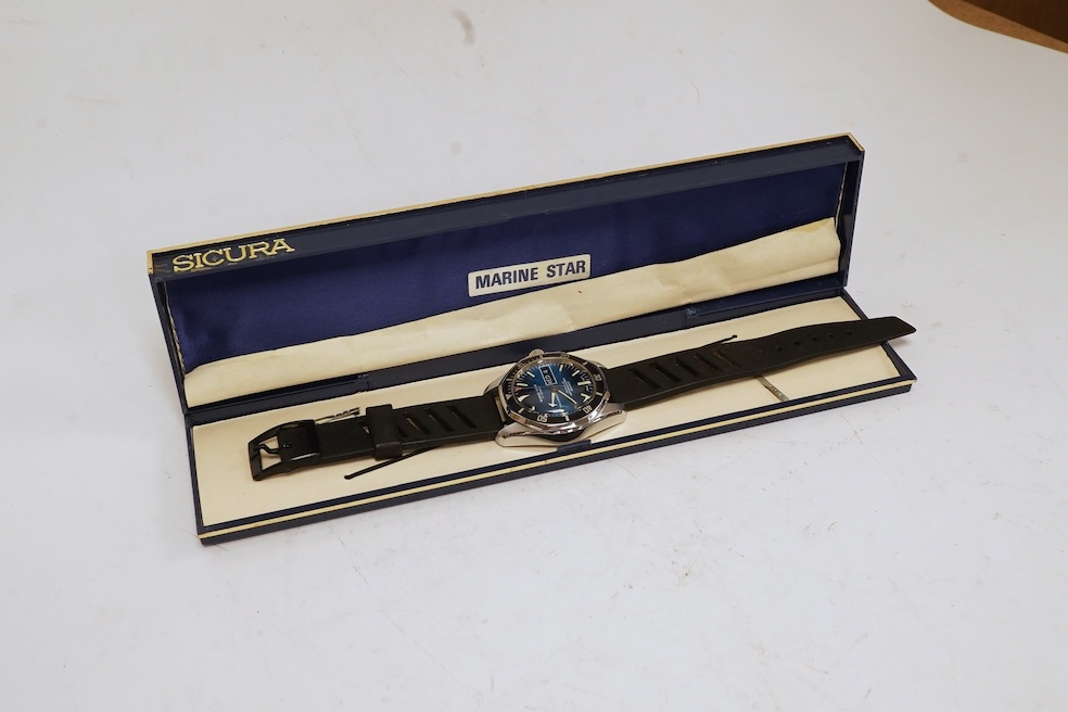 A gentleman's base metal Sicura Marine Star self-winding wrist watch, with baton numerals, two-tone dial and day/date aperture, case diameter 38mm, with box, no papers. Condition - fair to good